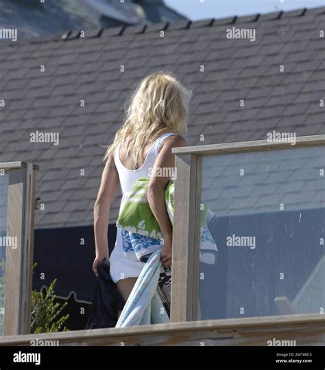 Baywatch Babe Pamela Anderson Tries To Hide From The Paparazzi Behind A Towel After Sunbathing