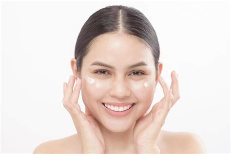 Close Up Beauty Portrait Of A Young Beautiful Smiling Woman Applying