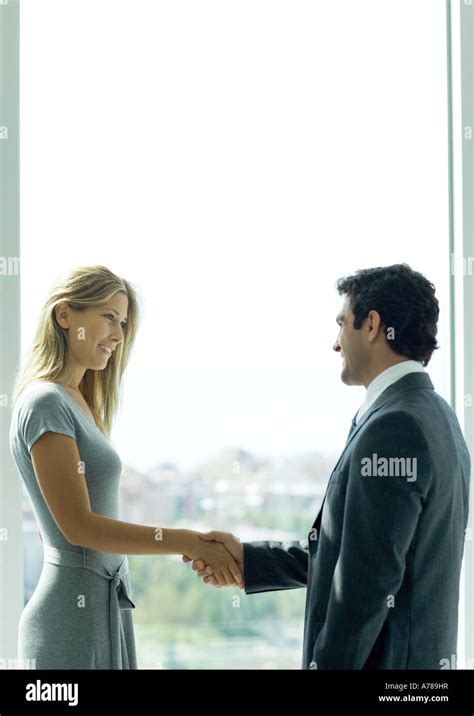 Man And Woman Shaking Hands Stock Photo Alamy