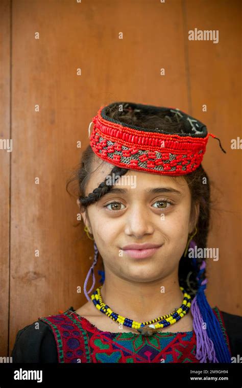 Portrait Of A Kalash Girl With Colorful Traditional Headdress Bumburet