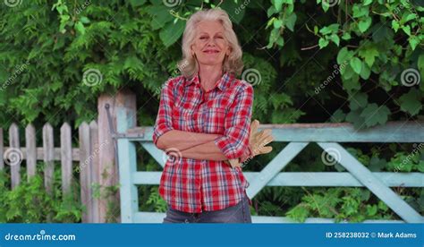 Mature Woman In Red Flannel Shirt Takes A Break From Working On The Farm Stock Footage Video