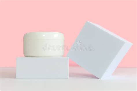 White Glass Cosmetic Jar With Cosmetic Cream For Body And Face Stock