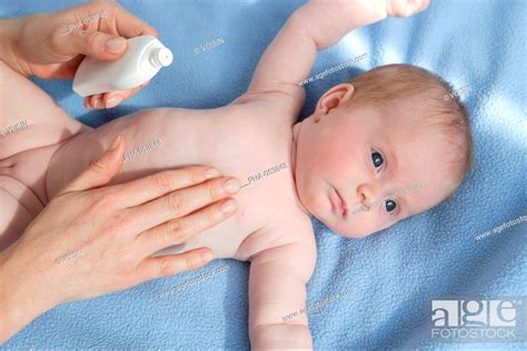 Application Of Cream On A 2 Months Old Baby Stock Photo Picture And