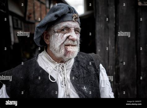 Senior Man Dressed In Traditional Tudor Costume At Tudor World