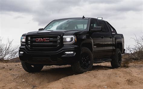 Download Gmc Sierra In All Black Color Wallpaper