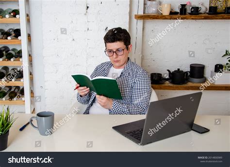 Woman Short Black Hair Glasses Sits Stock Photo 2014800989 Shutterstock