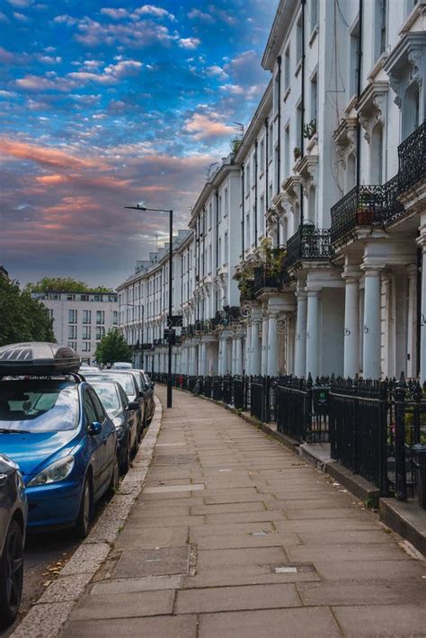 Elegant White Terraced Houses On A Tranquil Street In London At Dusk