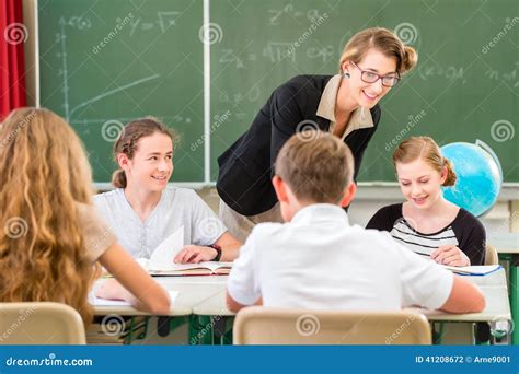 Teacher Teaching Students Geography Lessons In School Stock Photo