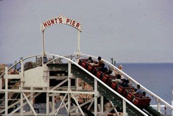 An Amusement Park Ride With People Riding It