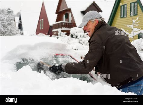 Man Removing Snow From Car Hi Res Stock Photography And Images Alamy