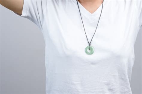 Premium Photo Woman Wearing Round Jade Necklace Around Her Neck