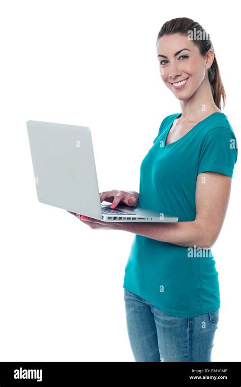 Woman with a bright smile, using laptop Stock Photo - Alamy