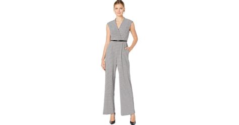 Calvin Klein Synthetic Belted Plaid Jumpsuit In Black Lyst