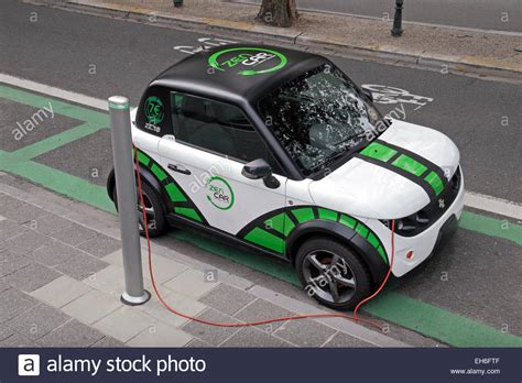 A Zen Car (car sharing) electric car plugged in to a road side power ...