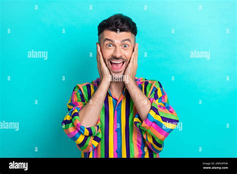 Photo Of Overjoyed Astonished Man Brunet Hair Dressed Striped Shirt Impressed Arms Cheekbones