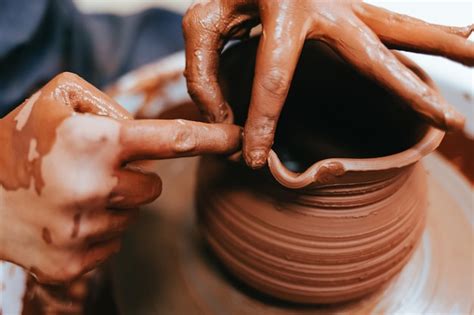 Premium Photo Woman Potter Shaping Clay Dishes On A Pottery Wheel