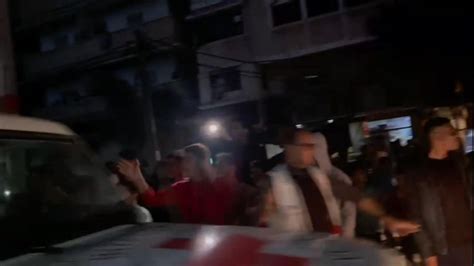 Israel-Hamas war: Crowd cheers as hostages transported from Gaza in Red ...