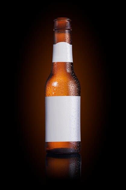 Premium Photo Beer Bottle With A Blank Label On A Black Background