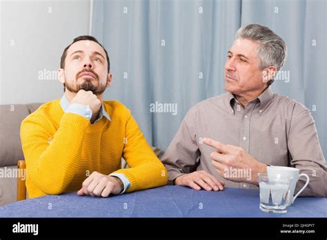 Mature Father And Son Serious Talk Stock Photo Alamy