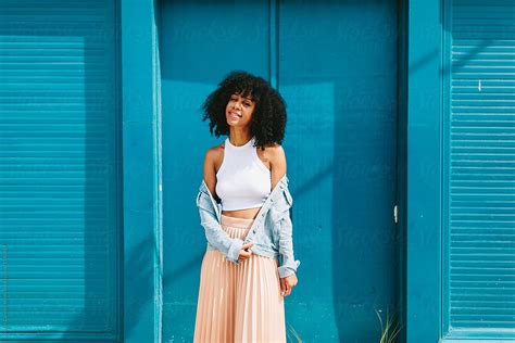 Portrait Of A Beautiful Young Black Woman Posing Outdoors By Stocksy Contributor Kristen