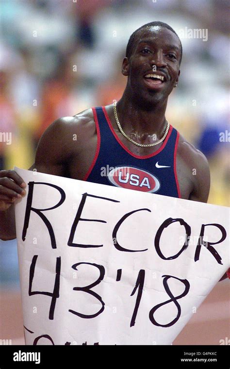 American Micheal Johnson proudly displays his new 400m World Record ...