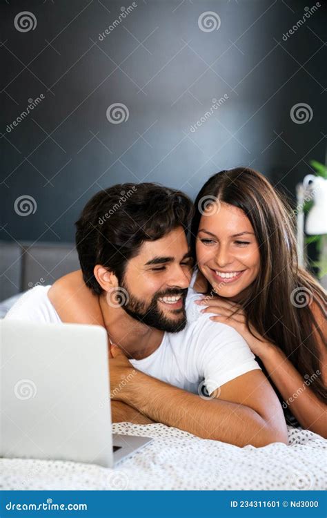 Happy Young Man And Woman Is Having Fun In Bed Together Stock Image