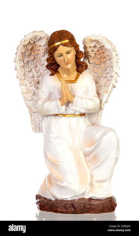 Ceramic figure of the angel of the nativity scene isolated on a white ...