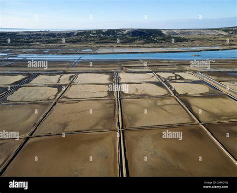 Aerial drone view of Salt Fields in Solana Pag, the largest sea-salt producer in Croatia, and ...