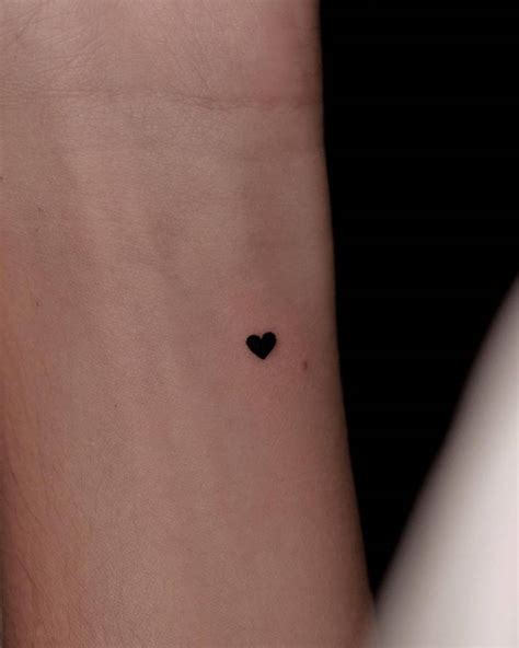 Tiny Heart Tattoo Located On The Wrist Minimalistic