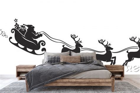 Naklejka Silhouette Of Santa Claus Riding In A Sleigh With Reindeer