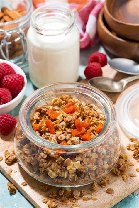 Homemade Granola With Dried Apricots And Nuts In A Jar Vertical Top