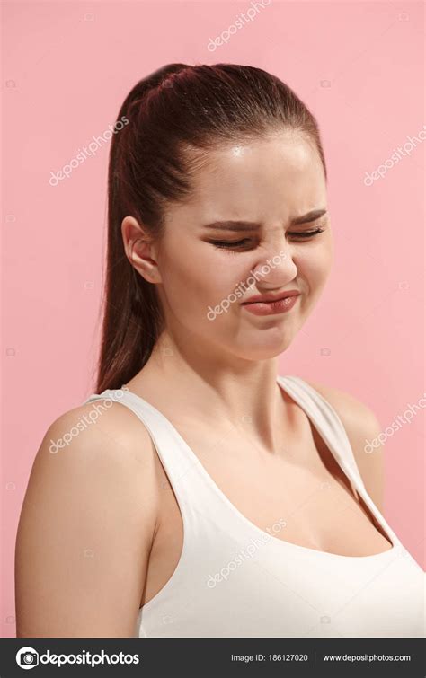 Young Woman With Disgusted Expression Repulsing Something Isolated On