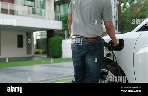 Progressive Concept Of Father And Daughter With Ev Car And Charging