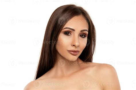 Close Up Portrait Of A Brunette Nude Model Girl With Professional Evening Make Up And Plump Lips