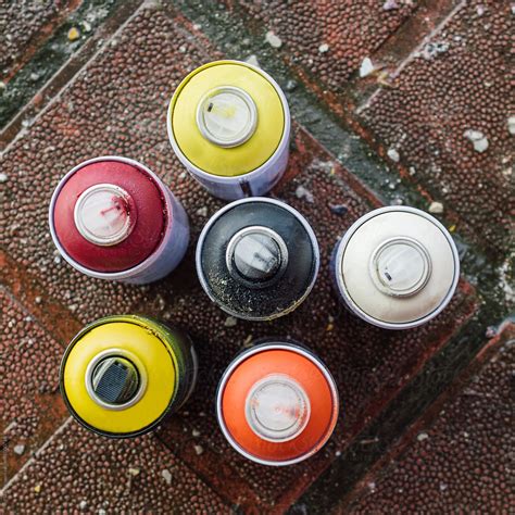 "Colorful Spray Paint Cans On The Ground" by Stocksy Contributor "Pixel ...