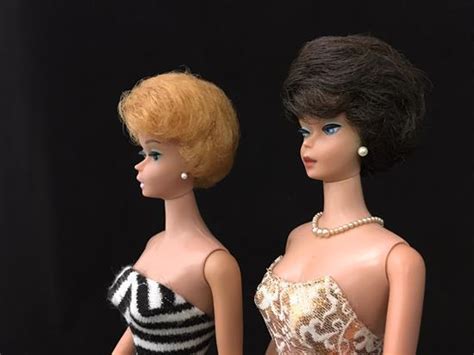 Lot Barbies Including A Brunette Bubble Cut Wearing Golden Girl Dress With Necklace And A