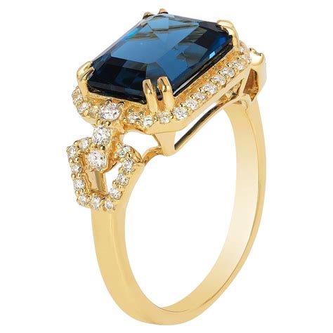 Goshwara East West Blue Topaz Emerald Cut Bezel Set Ring For Sale At 1stdibs