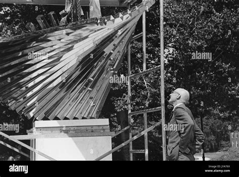 An Onlooker Examines The Centennial Sculpture Created By Sculptor