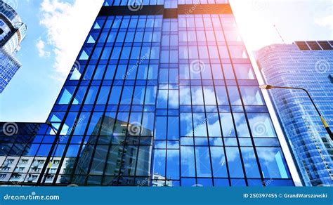 Modern Office Building With Glass Facade On A Clear Sky Background