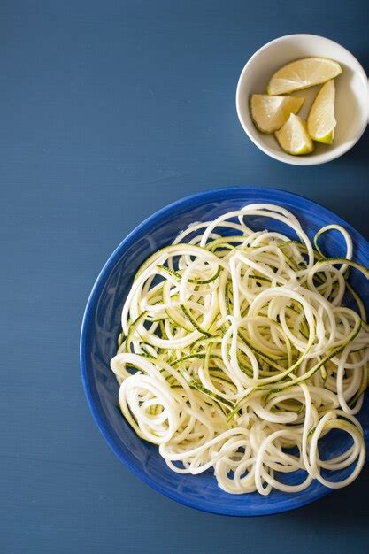 Premium Photo | Spiralized courgette raw vegetable noodles