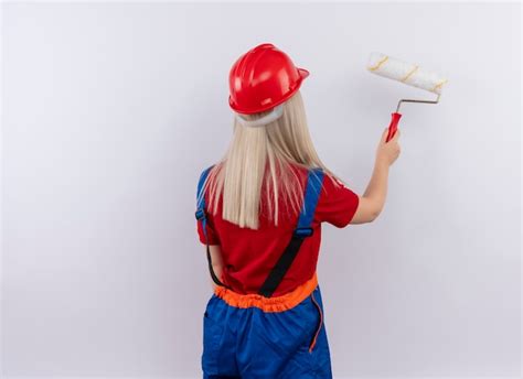 Jeune Fille Blonde Ing Nieur Constructeur En Peinture Uniforme Mur Avec