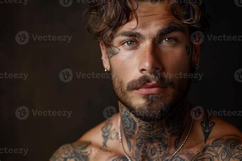 Portrait Of A Handsome Man With Tattoos And Facial Piercing 47694919