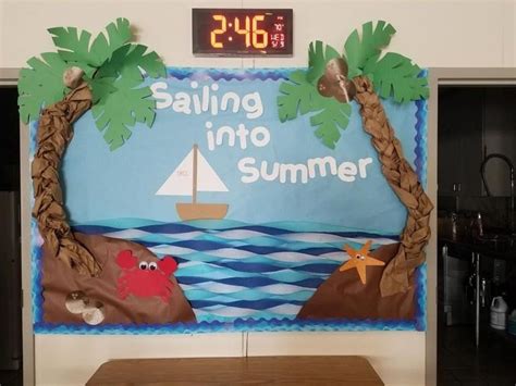 A Bulletin Board That Says Sailing Into Summer With Palm Trees And Crab