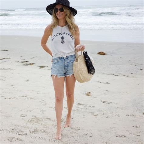 Beach Outfit With Denim Shorts And Graphic Tee Black Sunhat Vacation Outfit See More At