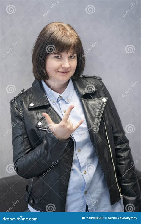 Young Rock Girl In Leather Jacket Punk Is Not Dead Girl Making Horn