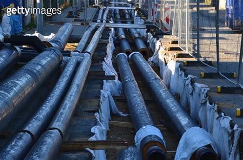 Installation Of Hot Water Pipes For Heating Apartments Insulated Pipes Are Laid In The Road For