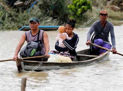 Filipino Villagers Riding On Makeshift Boat Editorial Stock Photo