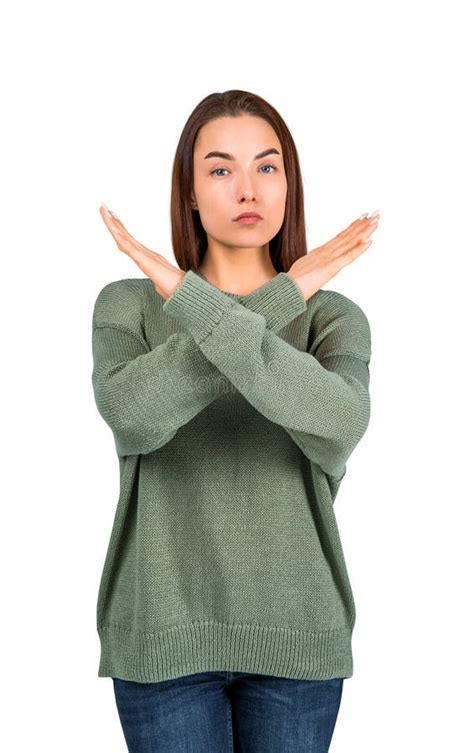 Woman In A Green Sweater Crossing Her Arms To Form An X In Front Stock