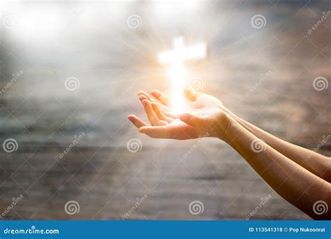 Woman With White Cross In Hands Praying On Sunlight Stock Photo ...