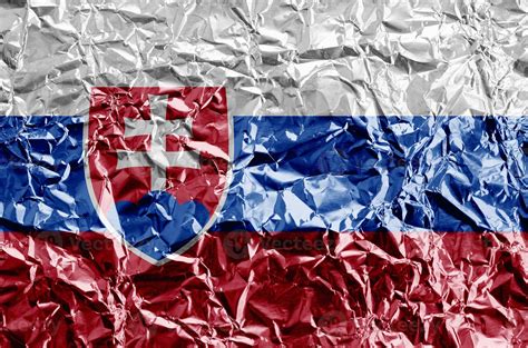 Slovakia flag depicted in paint colors on shiny crumpled aluminium foil ...